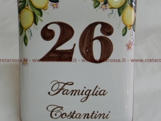 cod.art: nc06 - Mattonella in ceramica leggermente bombata cm 17x13 con limoni in alto e scritta personalizzata. 